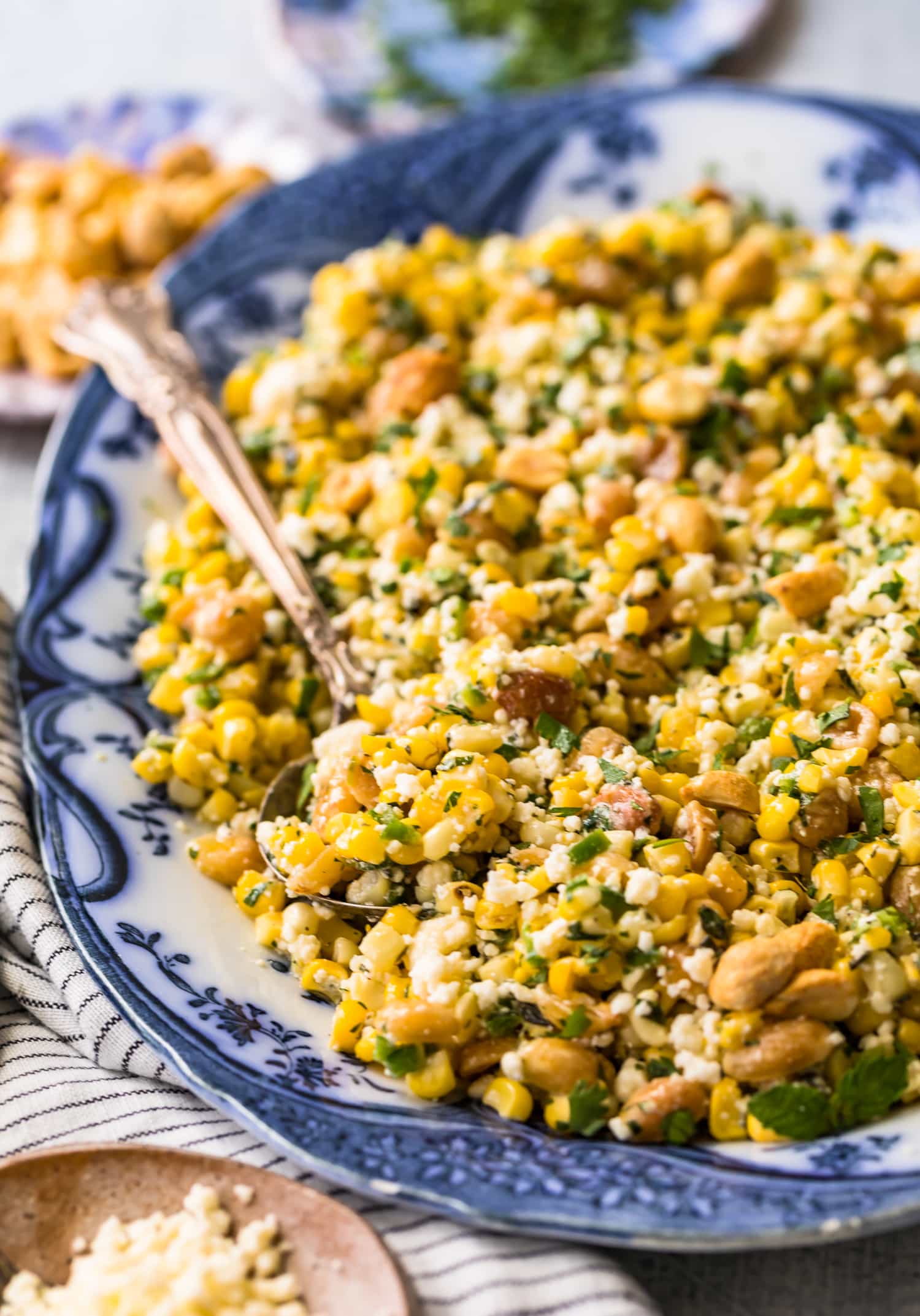 Prepared grilled corn salad on a serving plate