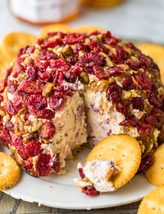 christmas cheese ball on a plate with crackers