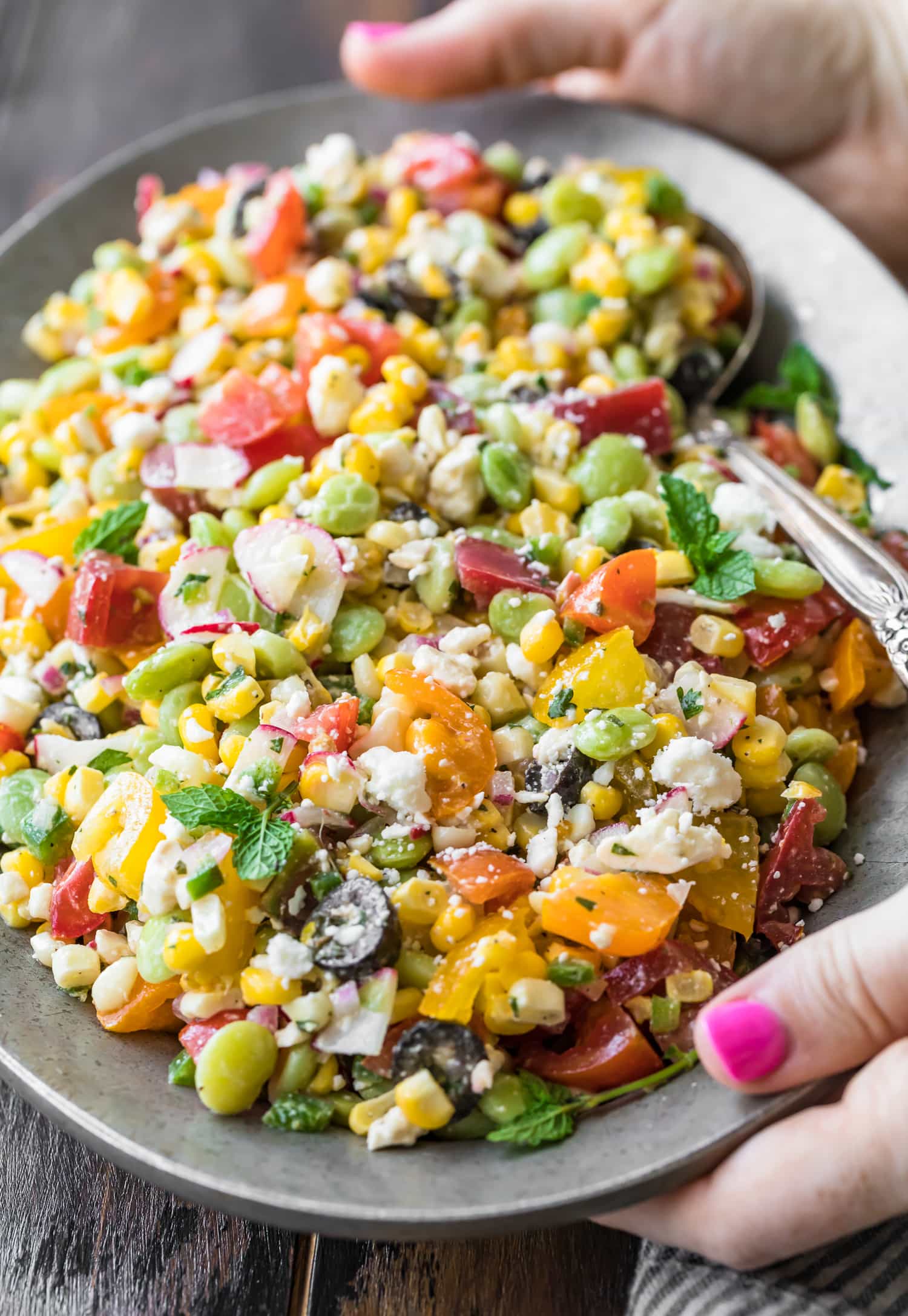 Peruvian chopped salad being served on a large plate