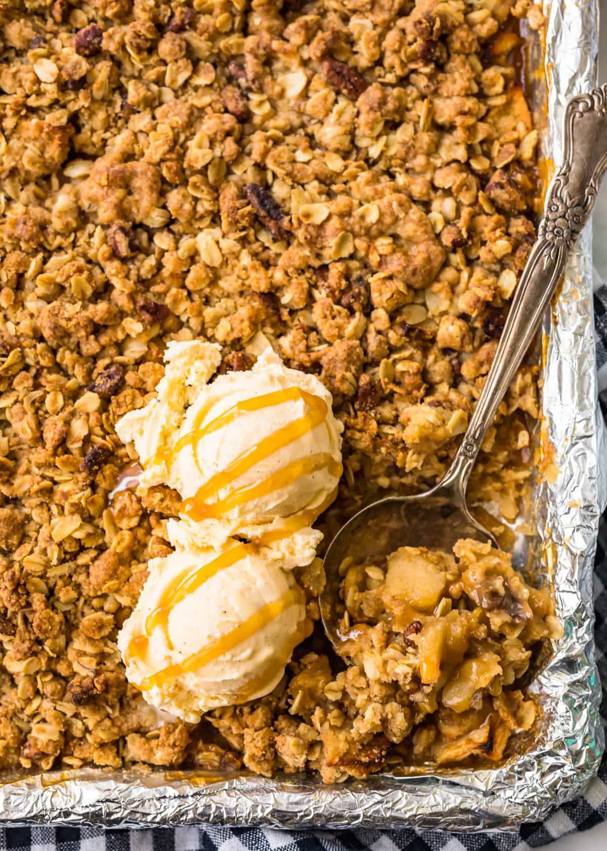 apple crisp topped with scoops of ice cream