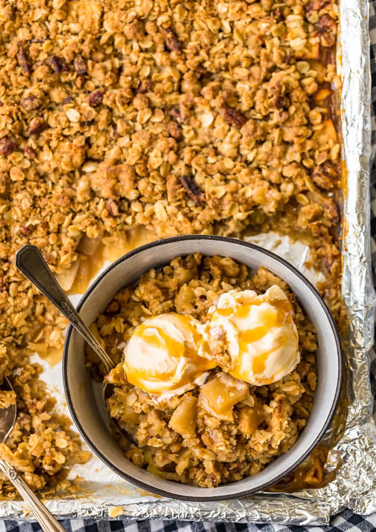 A bowl of apple crisp on a sheet pan