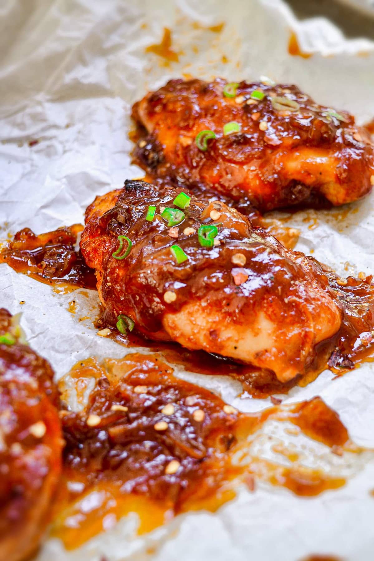 Chicken Breasts covered in sweet and sour glaze.