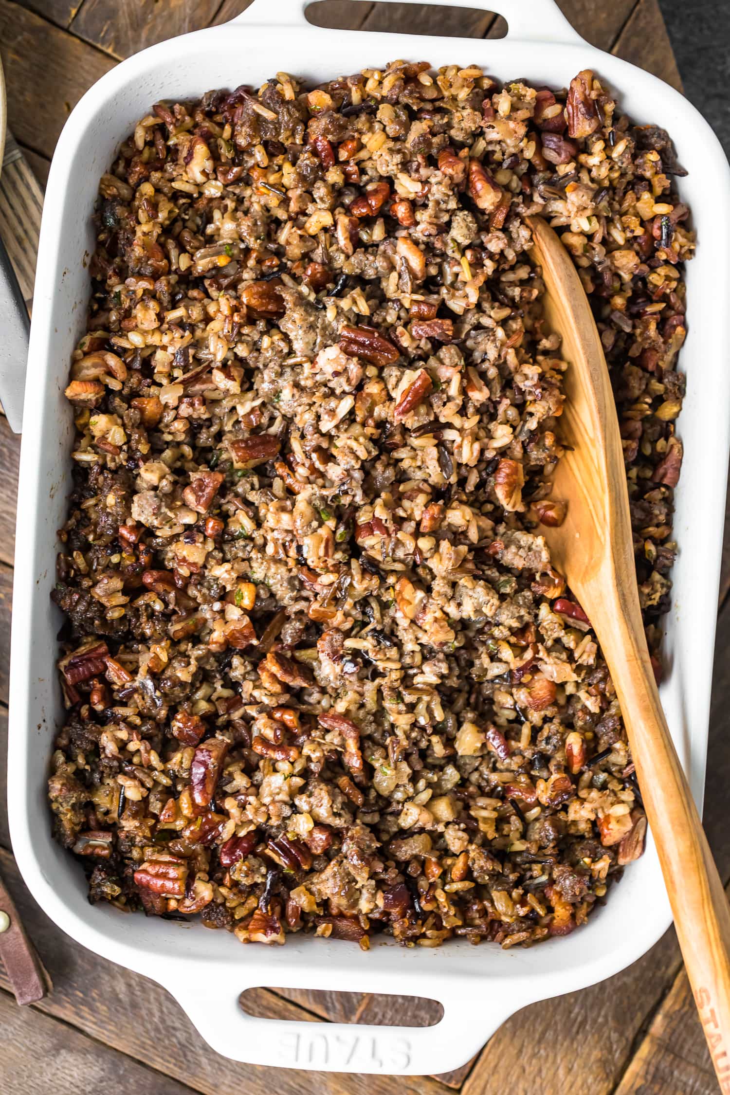 Wild Rice Sausage Stuffing in a white casserole dish