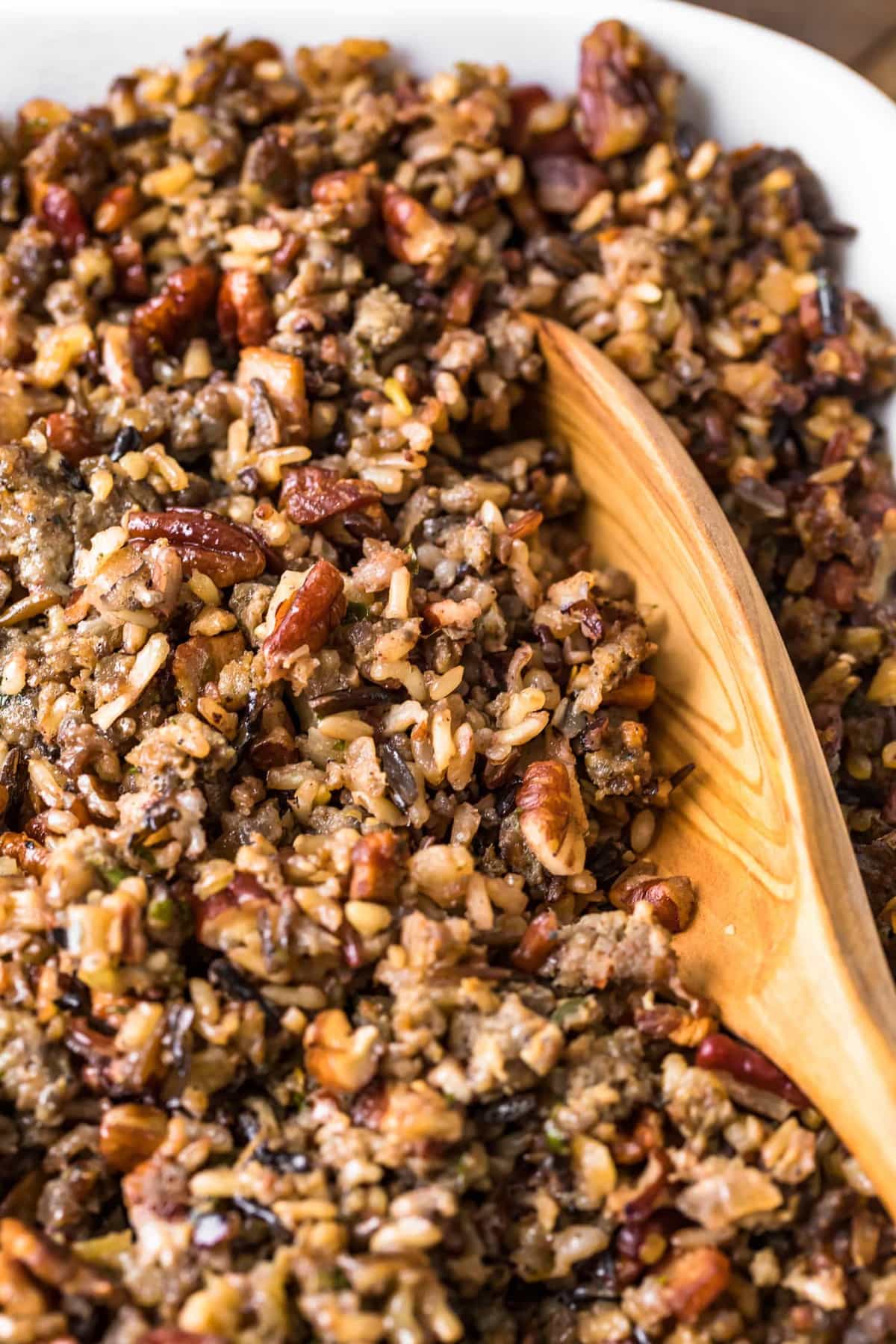 Close up of a spoon in Wild Rice Sausage Stuffing