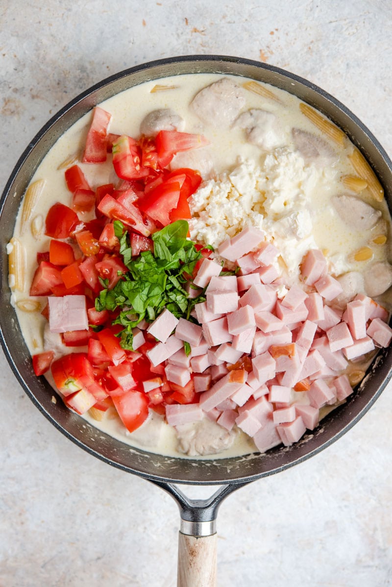 One-Pot Chicken Alfredo with Feta is a creamy, decadent dish that tastes fancy but is super simple and versatile. Your family will love this one pot classic! Ingredients for making one pot chicken alfredo in a pan