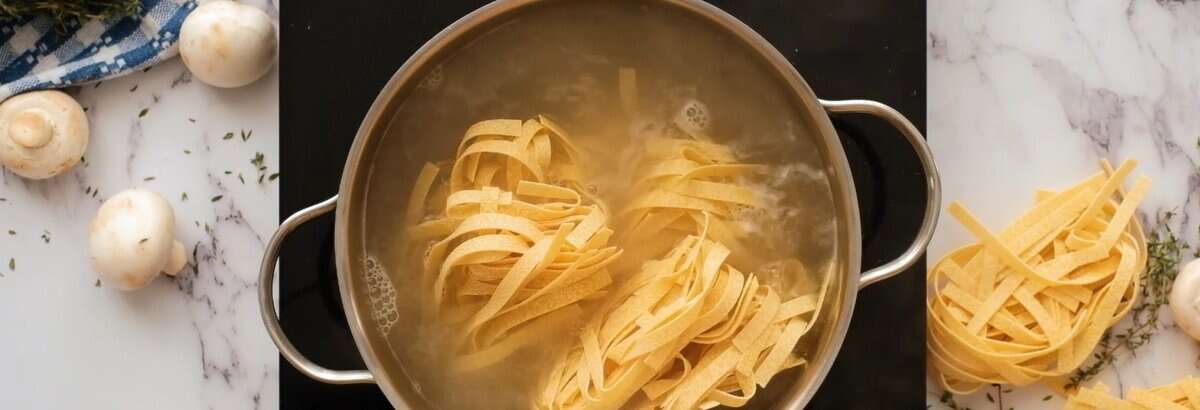 Boiling fettuccini noodles in a pot of water.