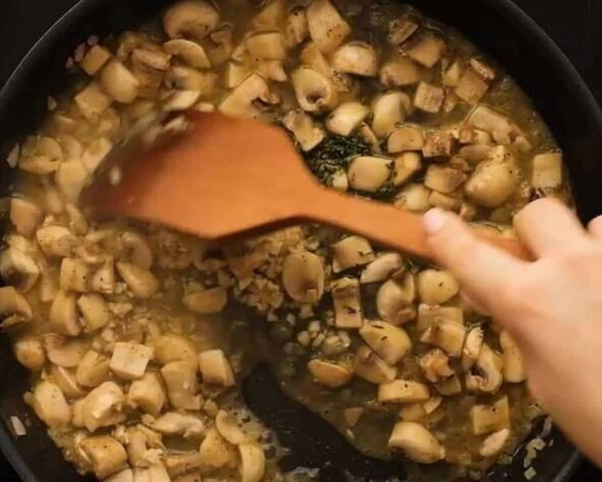 Adding wine and seasoning to the mushrooms.  - 8