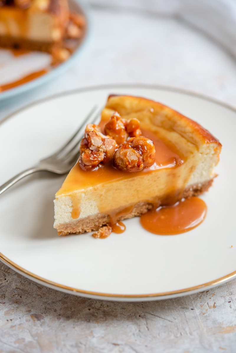 A slice of caramel cheesecake on a plate