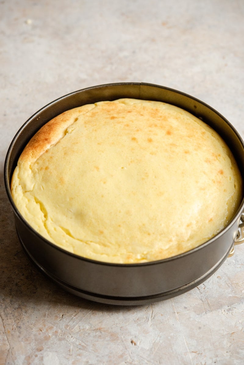 Baked caramel cheesecake in a cake tin