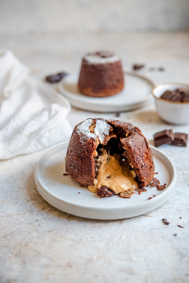 Chocolate Peanut Butter Lava Cakes on a plate with peanut butter oozing out