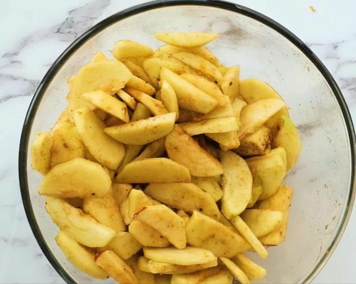 Apple slices tossed with a brown sugar mixture.