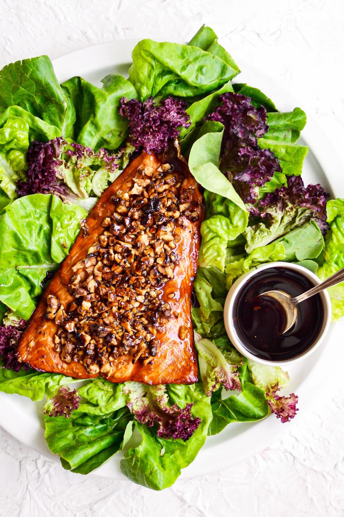 overhead shot of bourbon salmon with salad