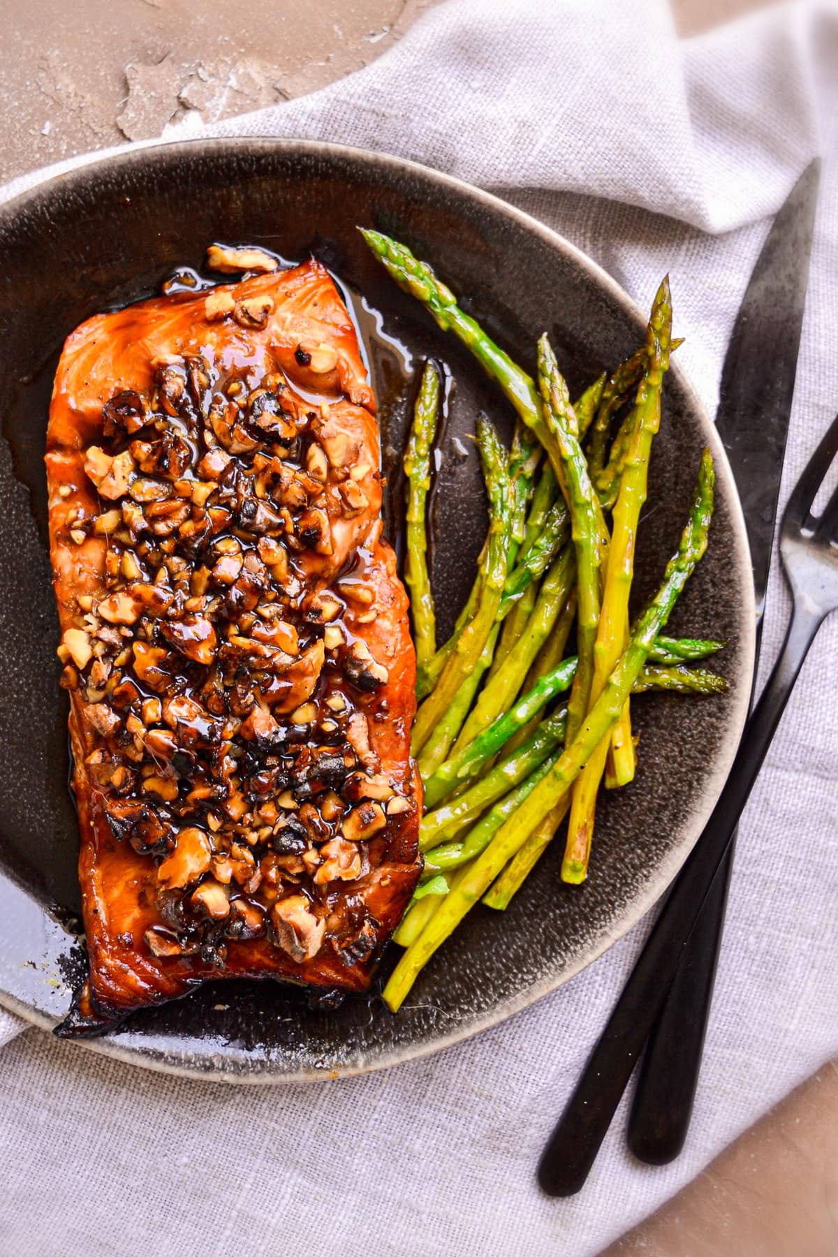 bourbon salmon on plate with asparagus