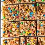 candy bar rice crispy treats cut into squares on cooling rack
