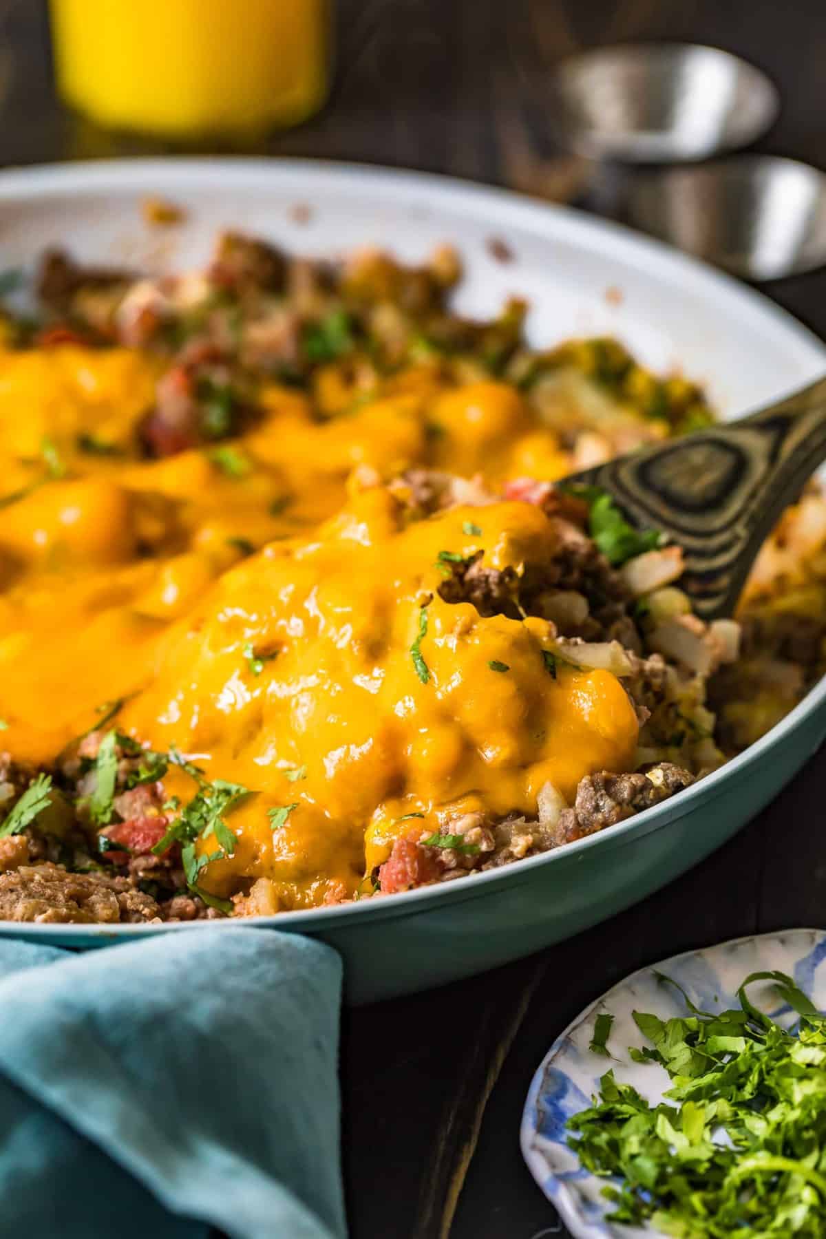 A spoon lifting up a portion of Beef Breakfast Scramble