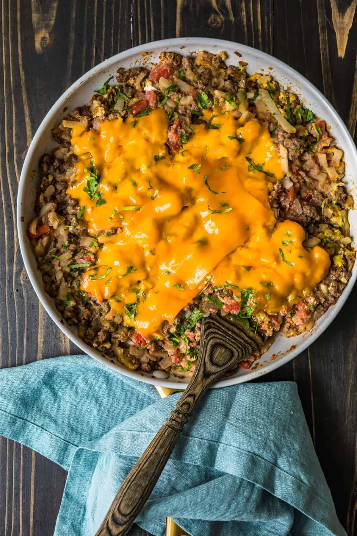 Beef Breakfast Scramble in a white skillet on a wooden background