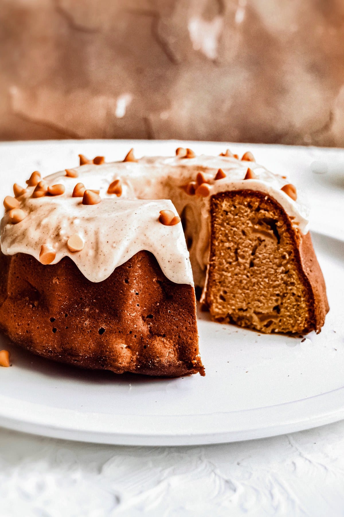 Chunky Apple Bundt Cake with a slice removed to show the interior.