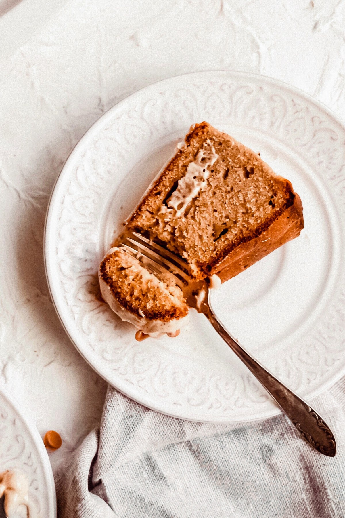 Apple Bundt Cake is the explicit formulation to impart hi there to autumn! This apple cinnamon cake is topped with a scrumptious cinnamon cream cheese icing and some cinnamon chips to spice up the season. This apple cake is made with cake mix, so it be trim easy and so fun to eat! chunky-apple-bundt-cake-recipe-6-of-7 chunky-apple-bundt-cake-recipe-6-of-7 Prick of apple cake on a white plate Corpulent Apple Bundt Cake chunky apple bundt cake recipe 6 of 7