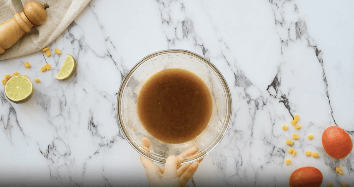 brown dressing in a glass bowl.