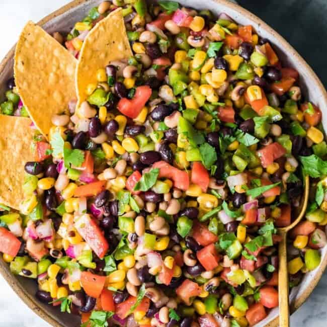 cowboy caviar in pan with chips