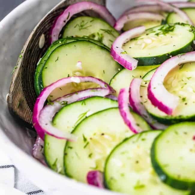Cucumber salad with red onion and dill.