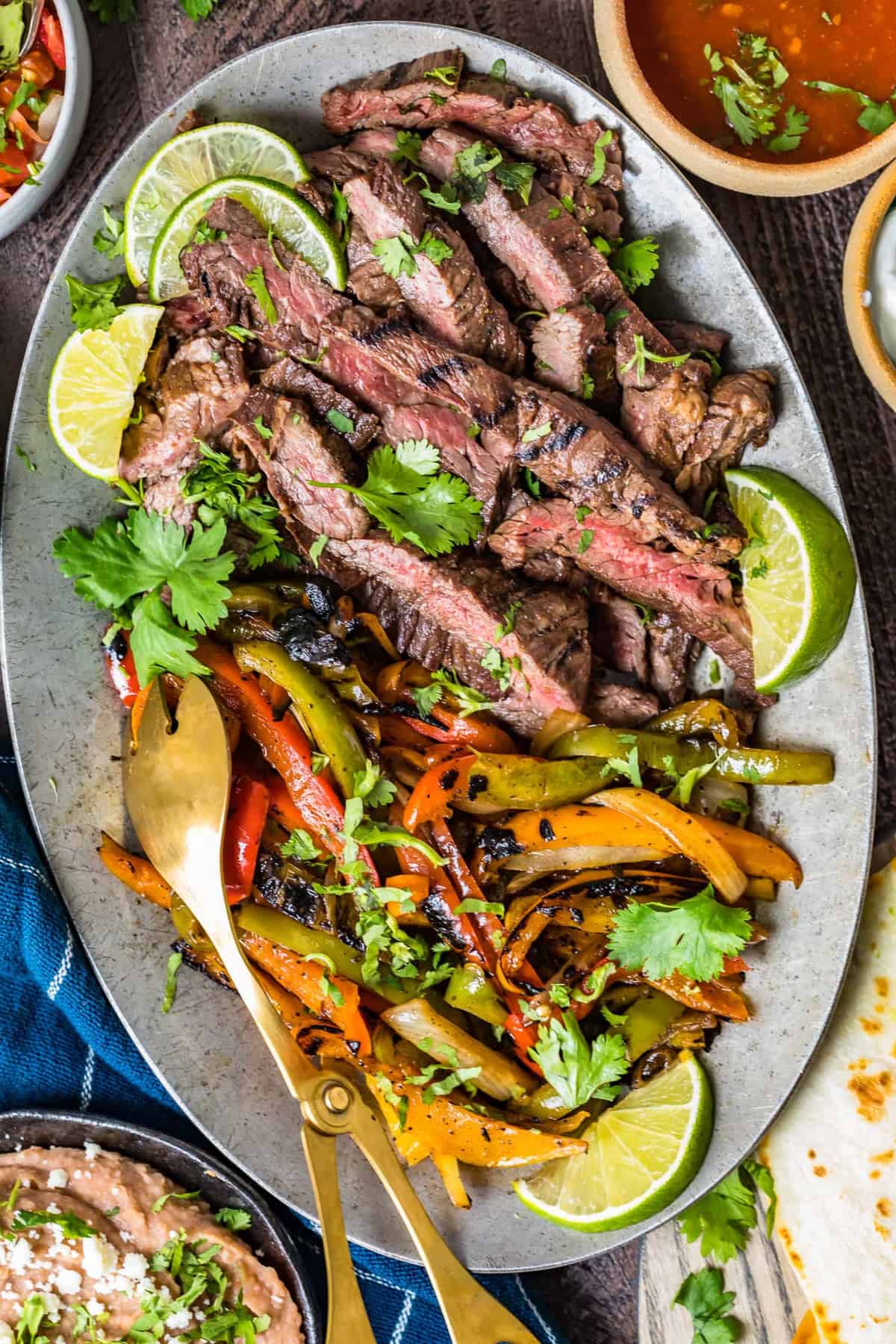 Grilled meat and vegetables on a large serving plate