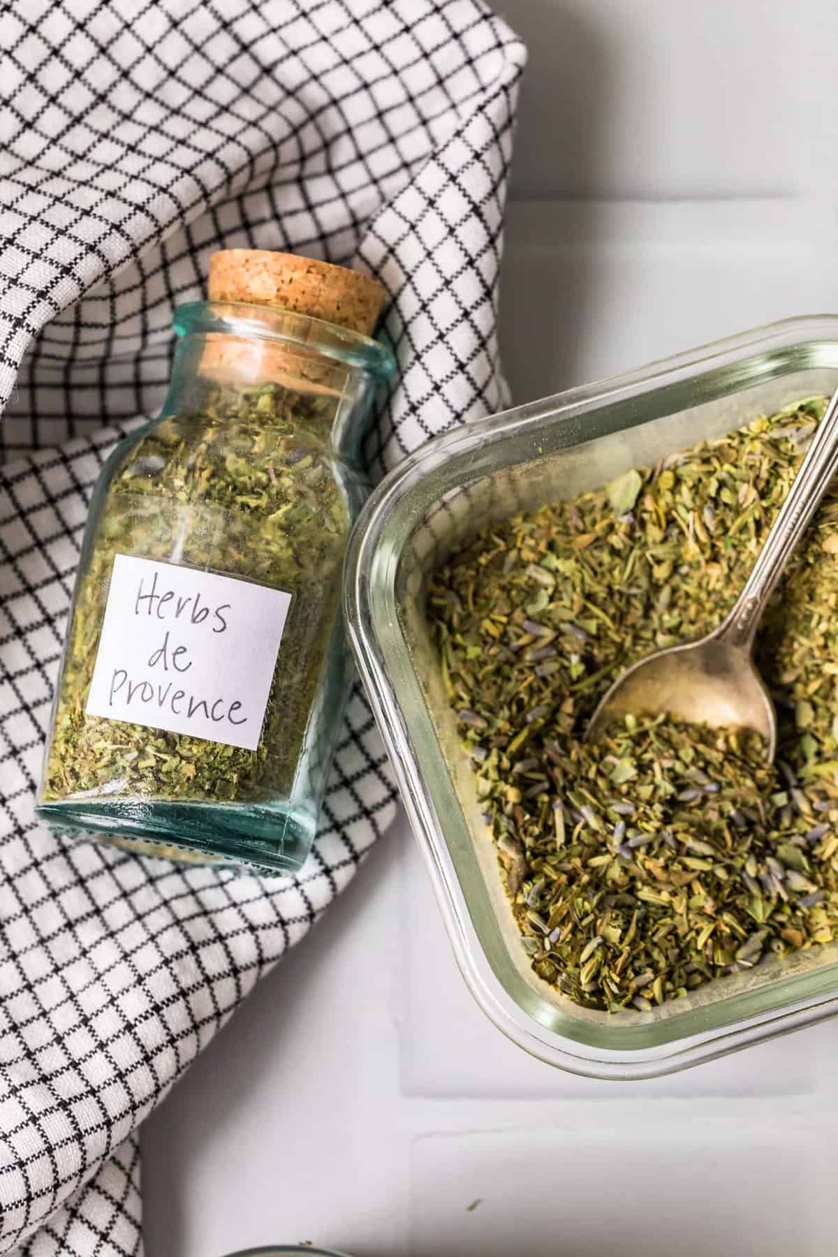 Herb mix in a glass jar and bowl