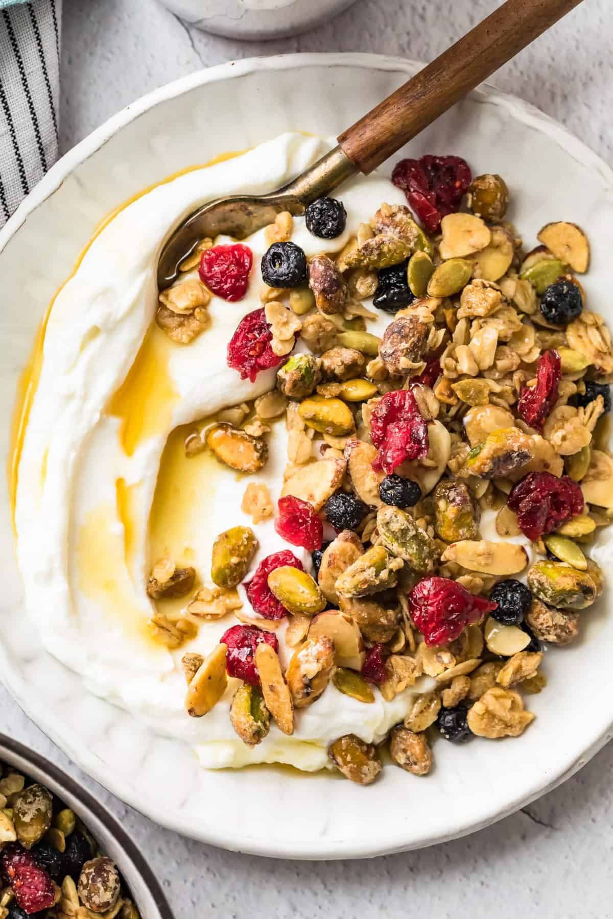 Baked maple syrup granola served with yogurt and maple syrup