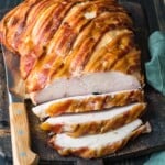 bacon wrapped turkey breast on cutting board
