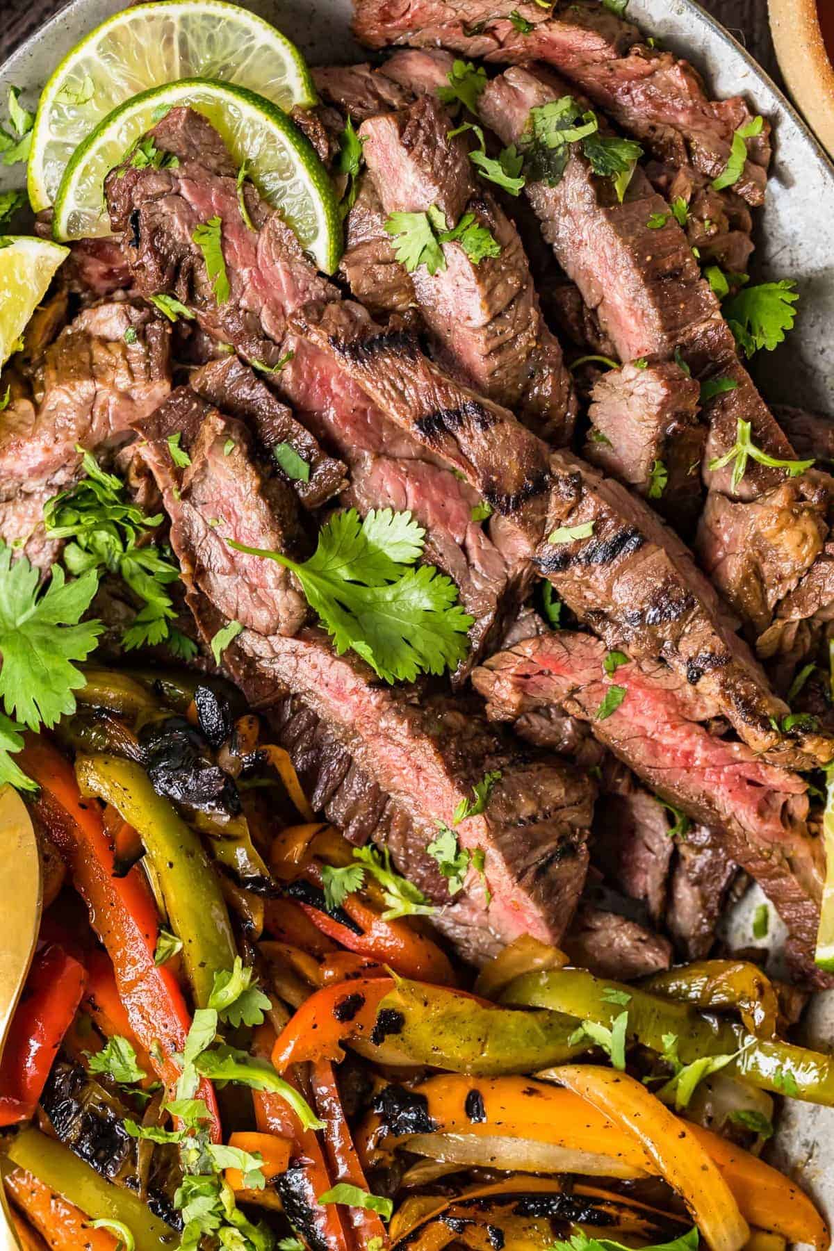 Close up of grilled steak and vegetables on a serving platter