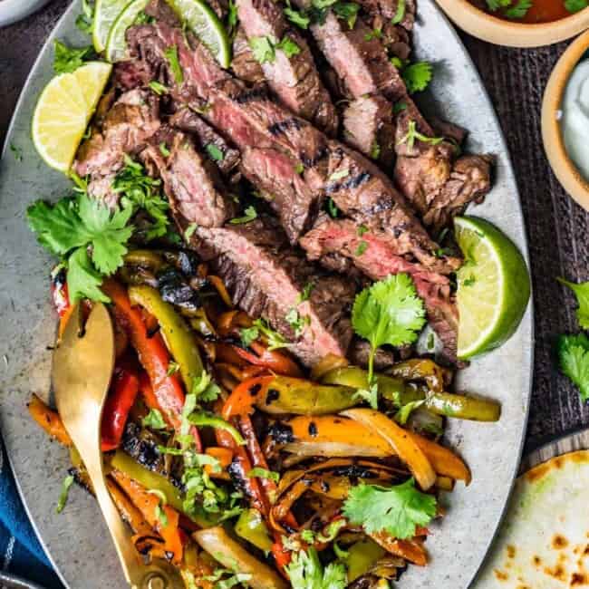 sliced steak and vegetables on a plate