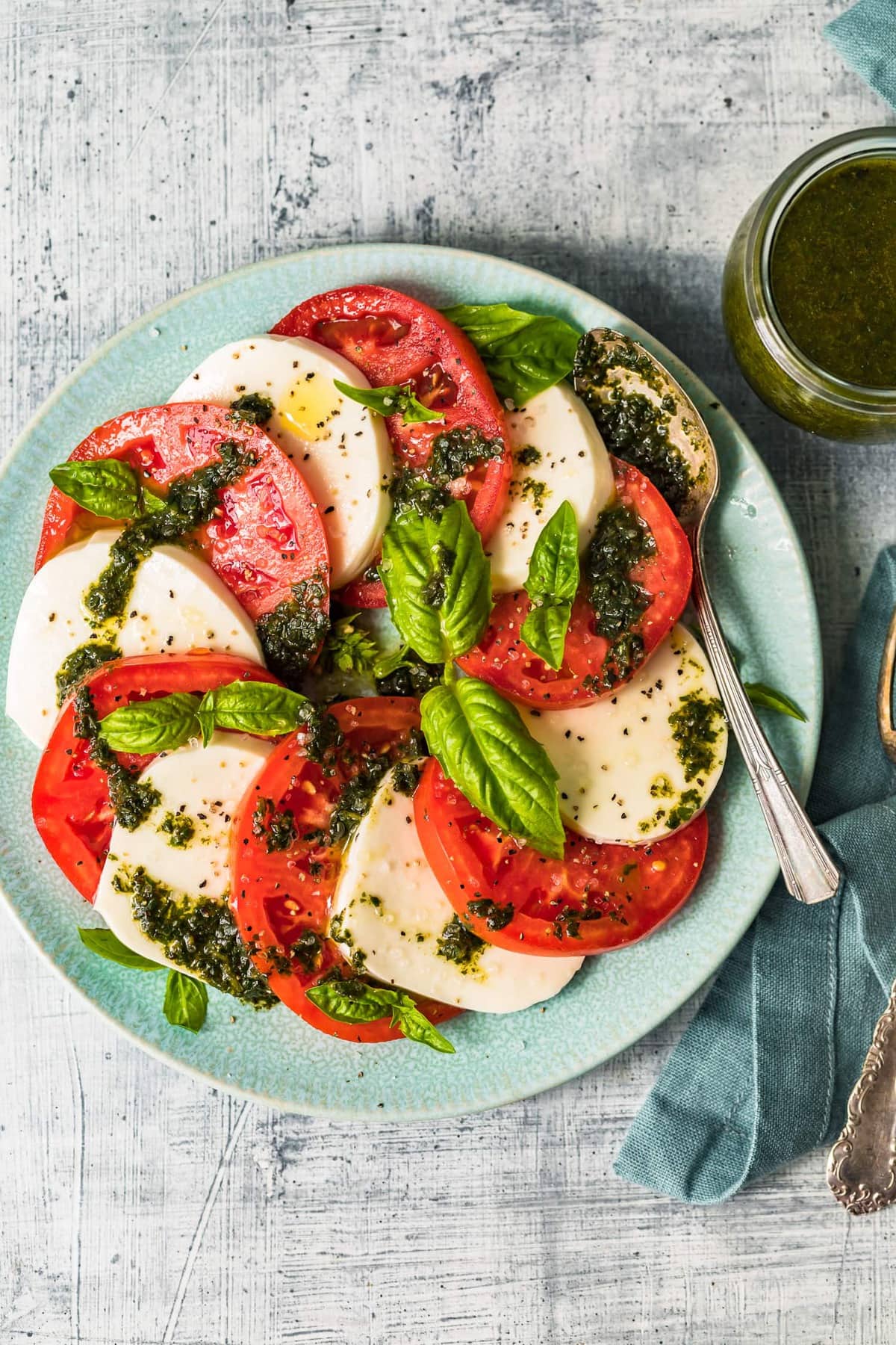 The best caprese salad served on a light blue plate