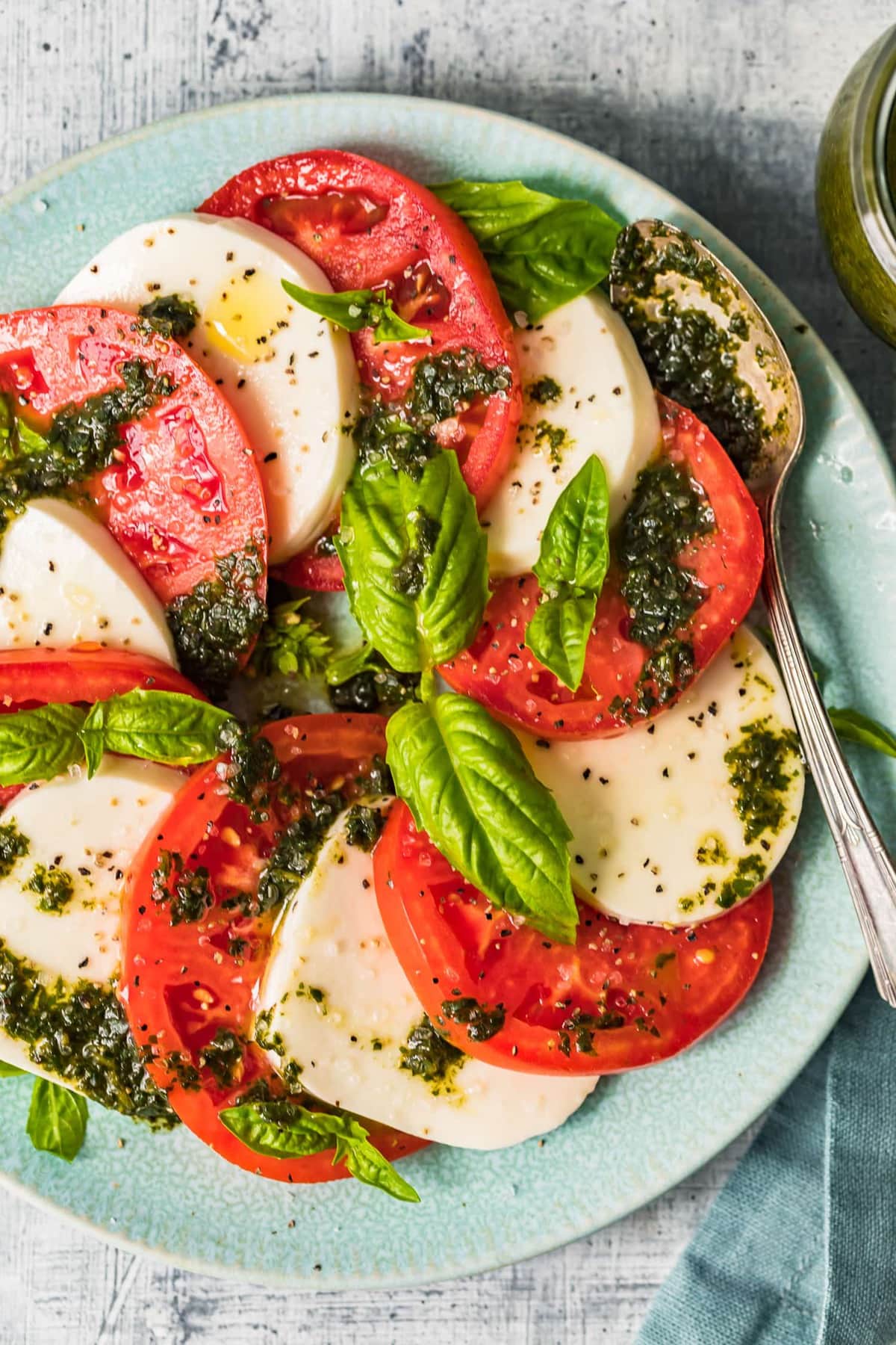 Top down shot of caprese salad with dressing