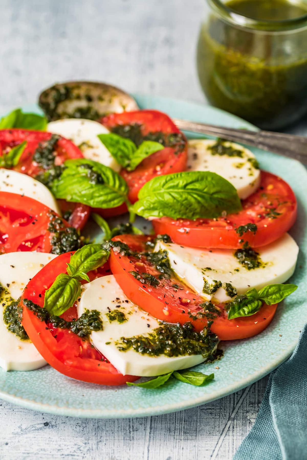 The best caprese salad dressed with fresh basil leaves