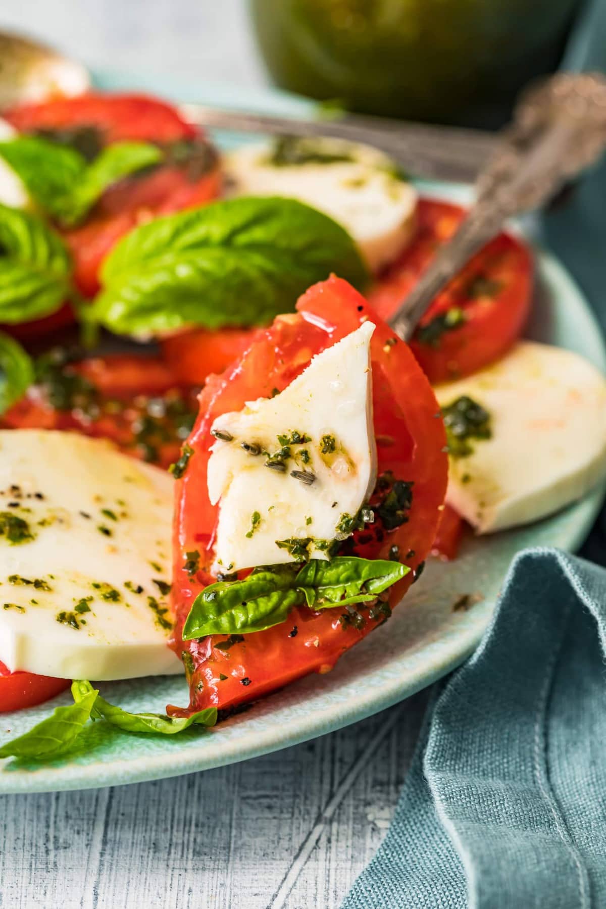 Tomato, mozzarella and basil on a fork