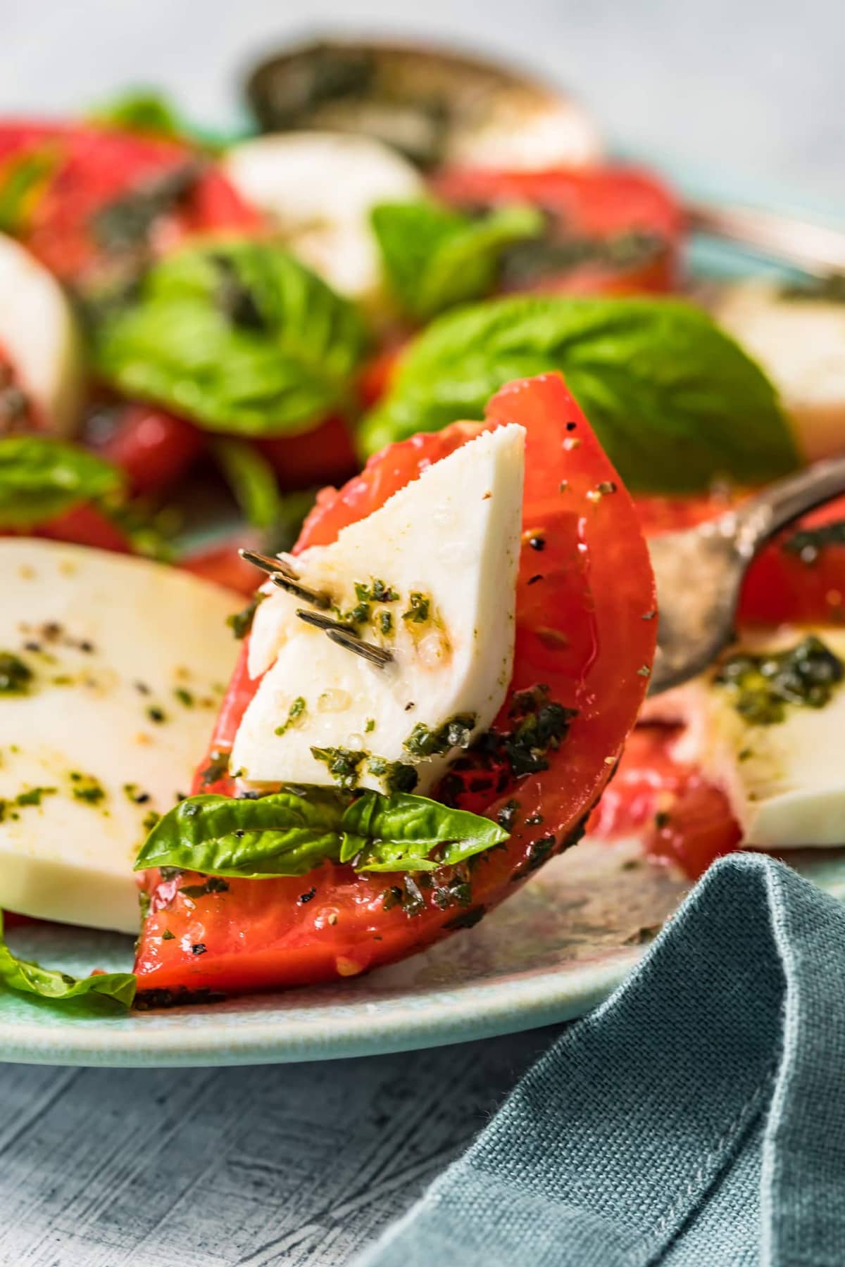 Close up of caprese salad on a fork