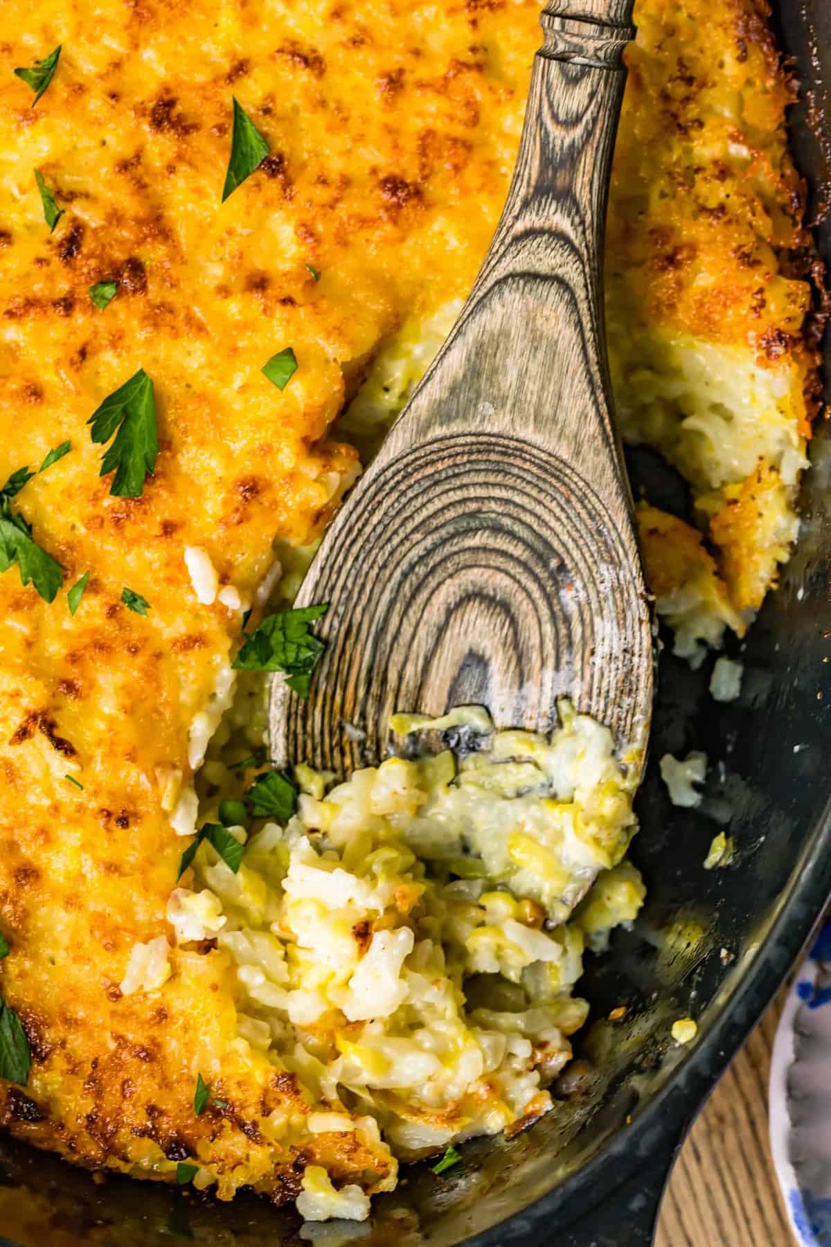 Close up of zucchini gratin on a wooden spoon