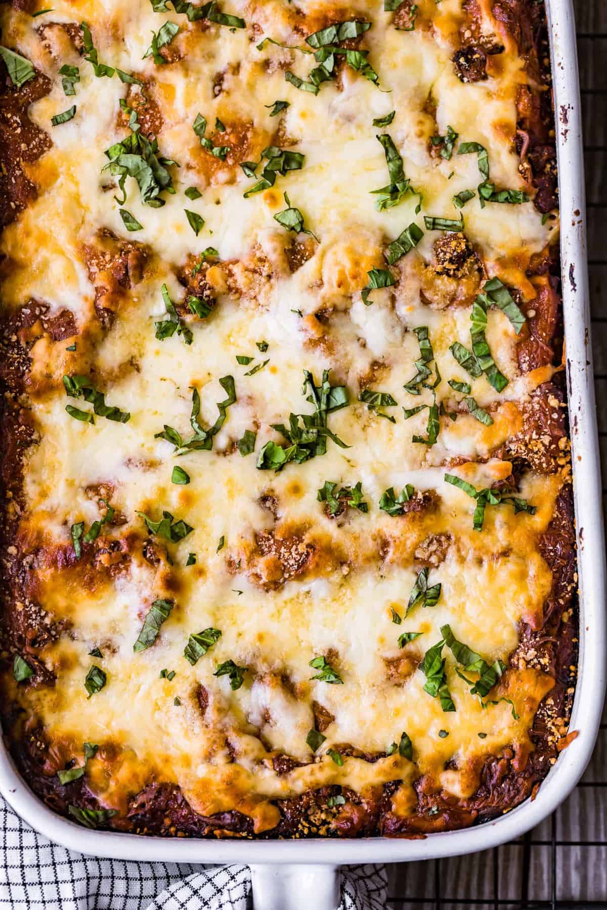 Baked lasagna garnished with fresh herbs