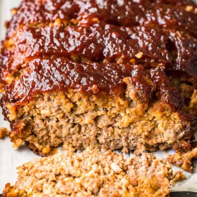 Bacon-wrapped meatloaf cooked on a baking sheet.