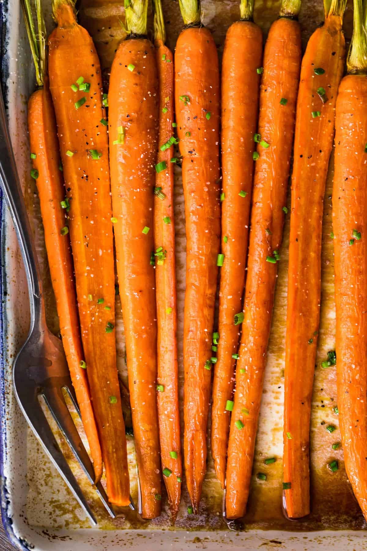 Brown Butter Glazed Carrots sprinkled with a green garnish
