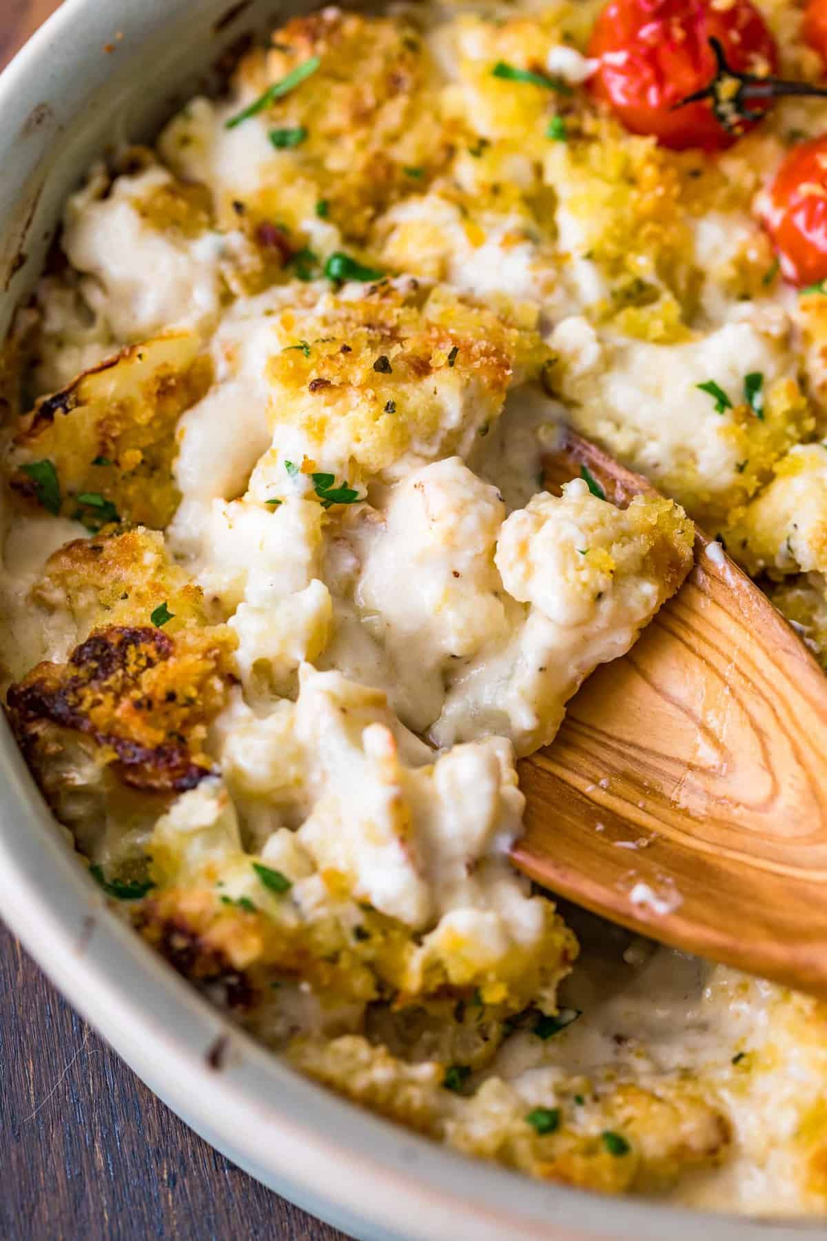 Close up of the Cauliflower Au Gratin on a wooden spoon