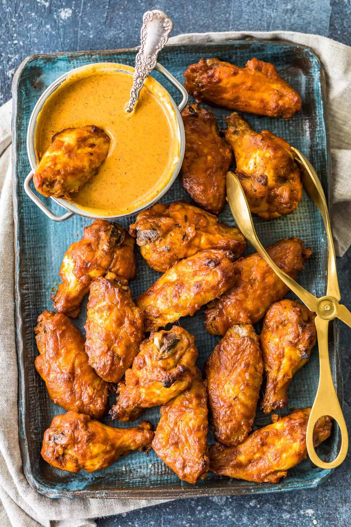 Chicken Tikka Masala Baked Wings served on a try with sauce