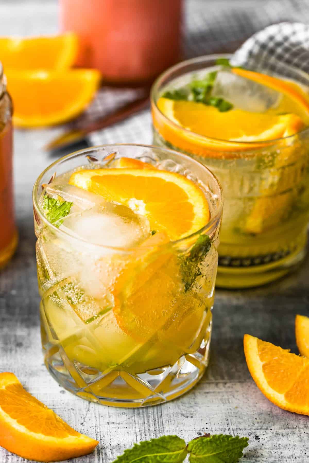 up top shot of cocktails garnished with sliced citrus fruit