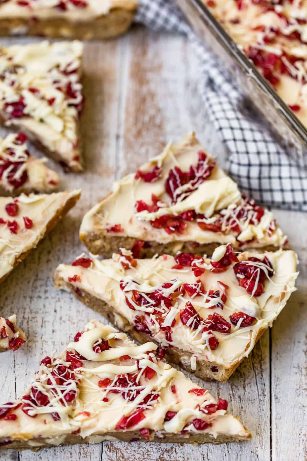 sliced cranberry bliss bars on a table