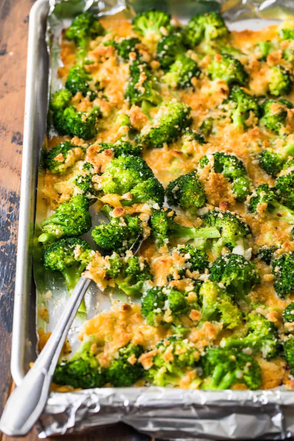 Cheesy Roasted Broccoli on a covered baking sheet