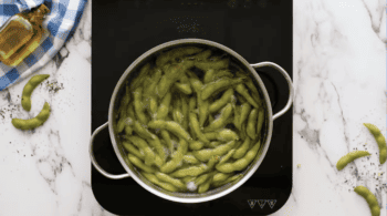 edamame in a pot of boiling water.