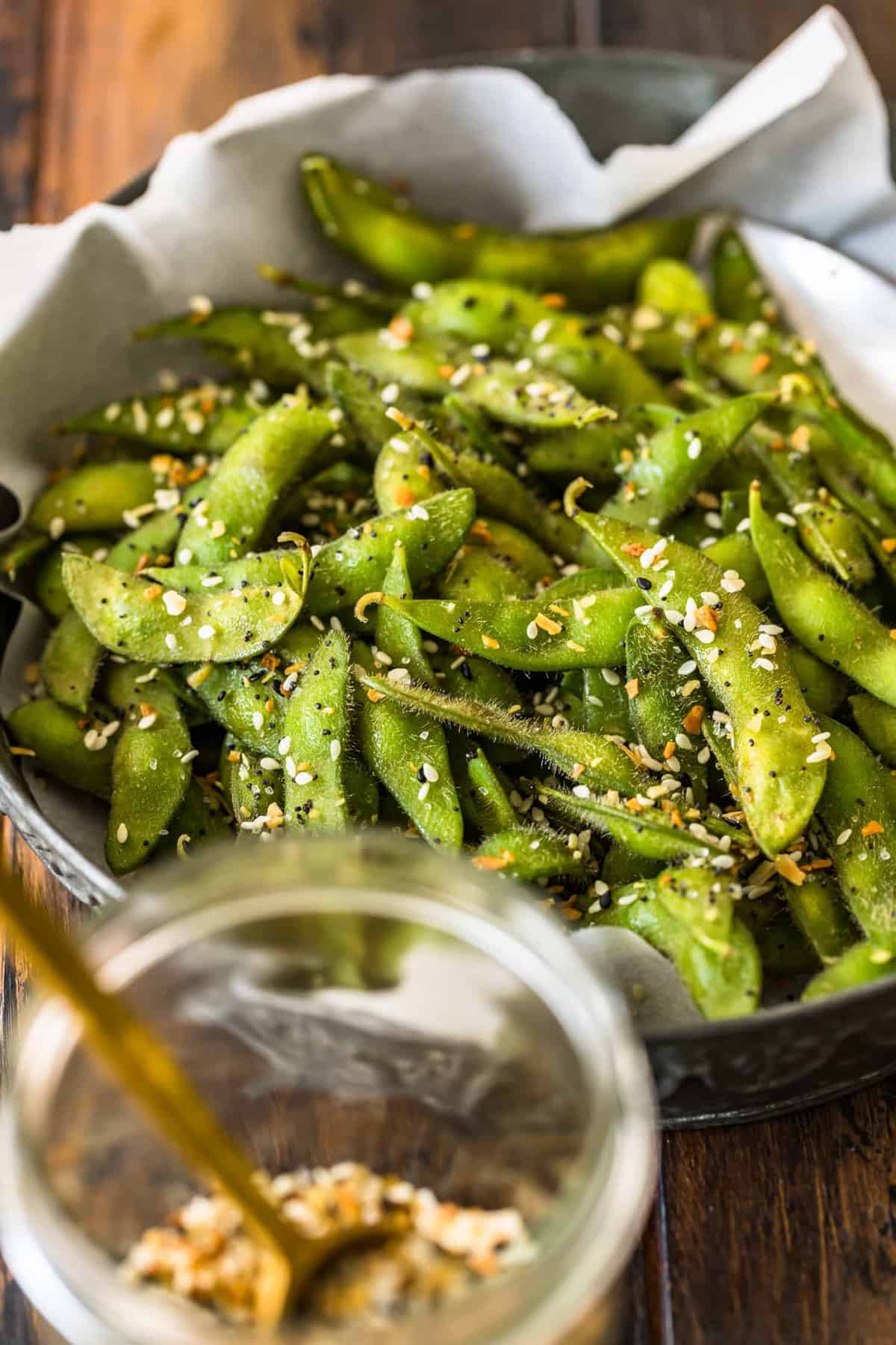 A close up view of bright green edamame seasoned well