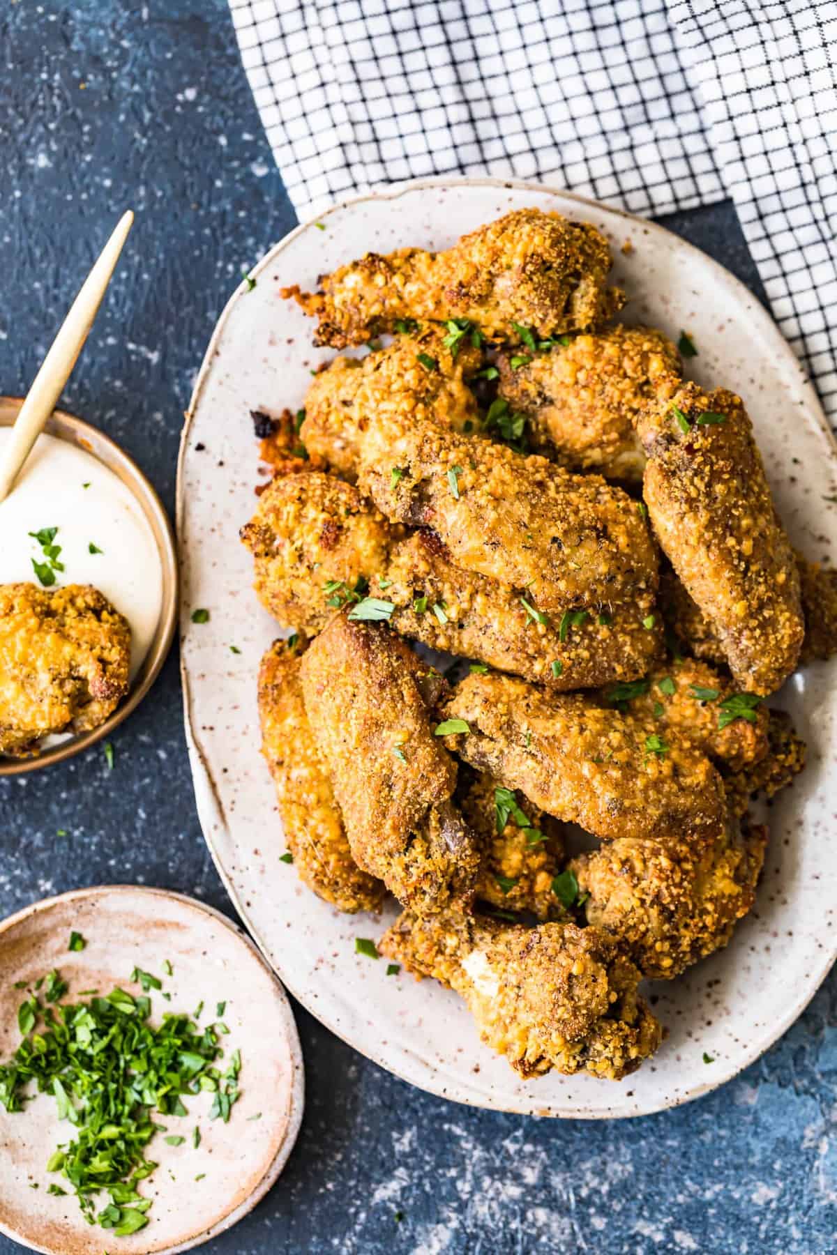 Garlic Parmesan Chicken Wings garnished with fresh herbs