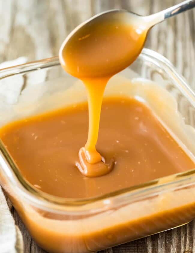 caramel falling from spoon into dish