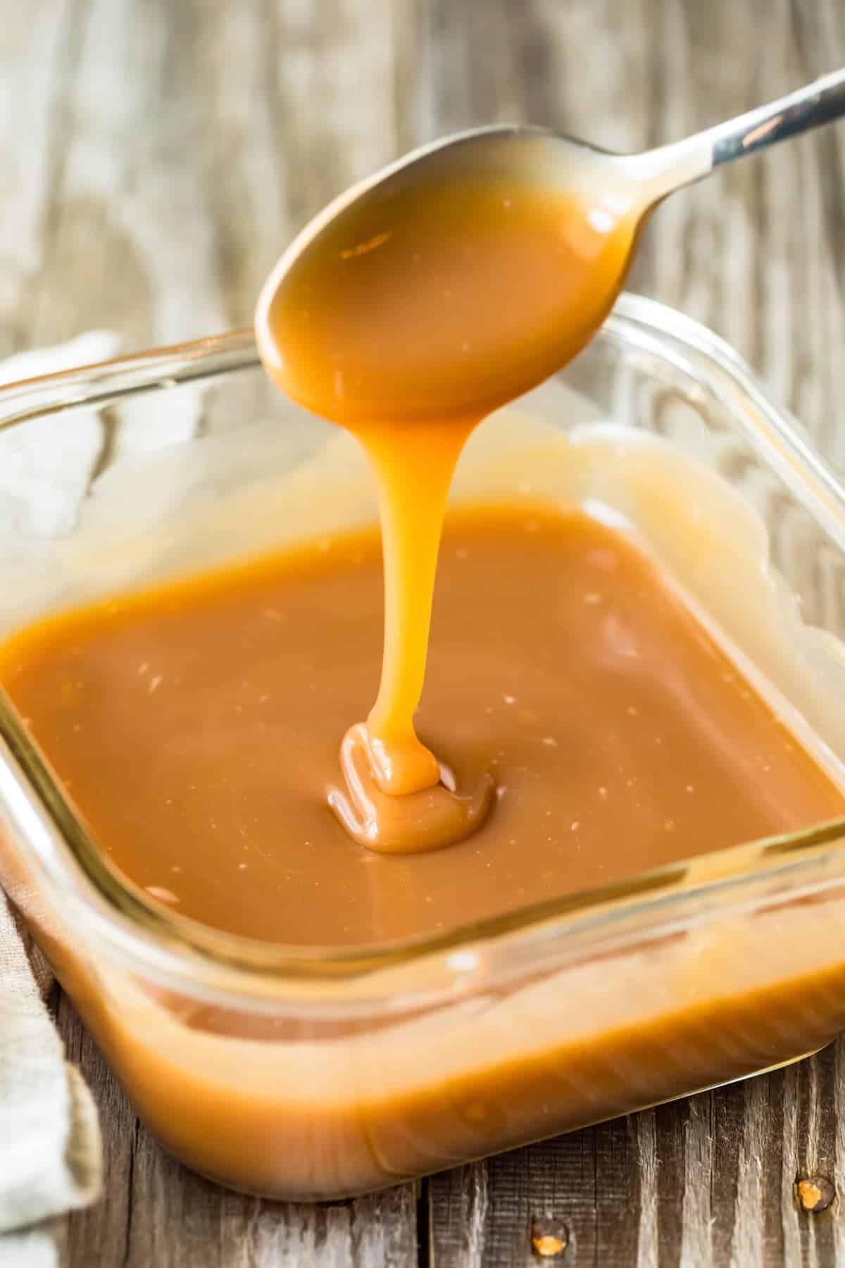 Caramel Sauce dripping from a spoon